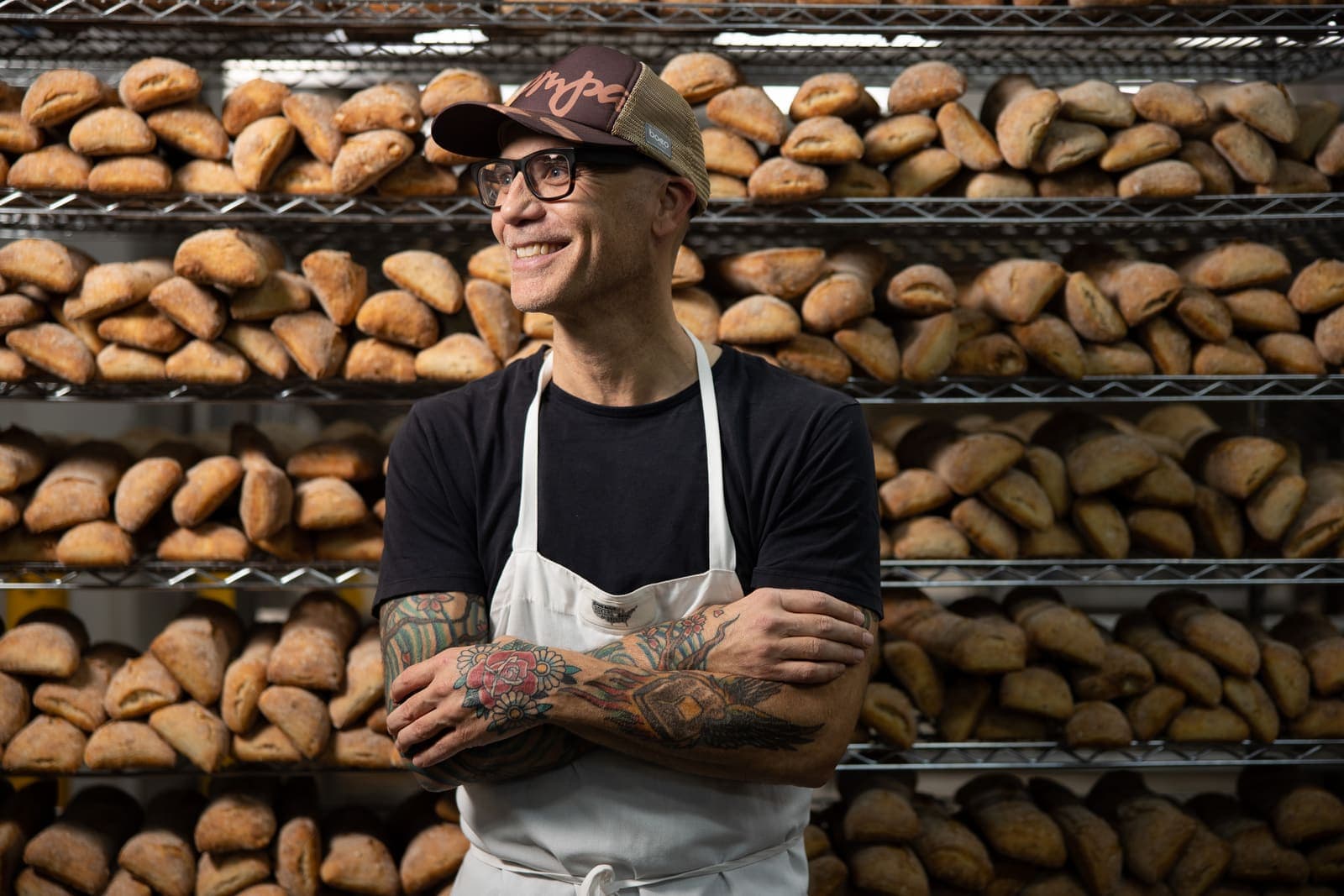 Commercial bakery brand photography with fresh bread and production staff